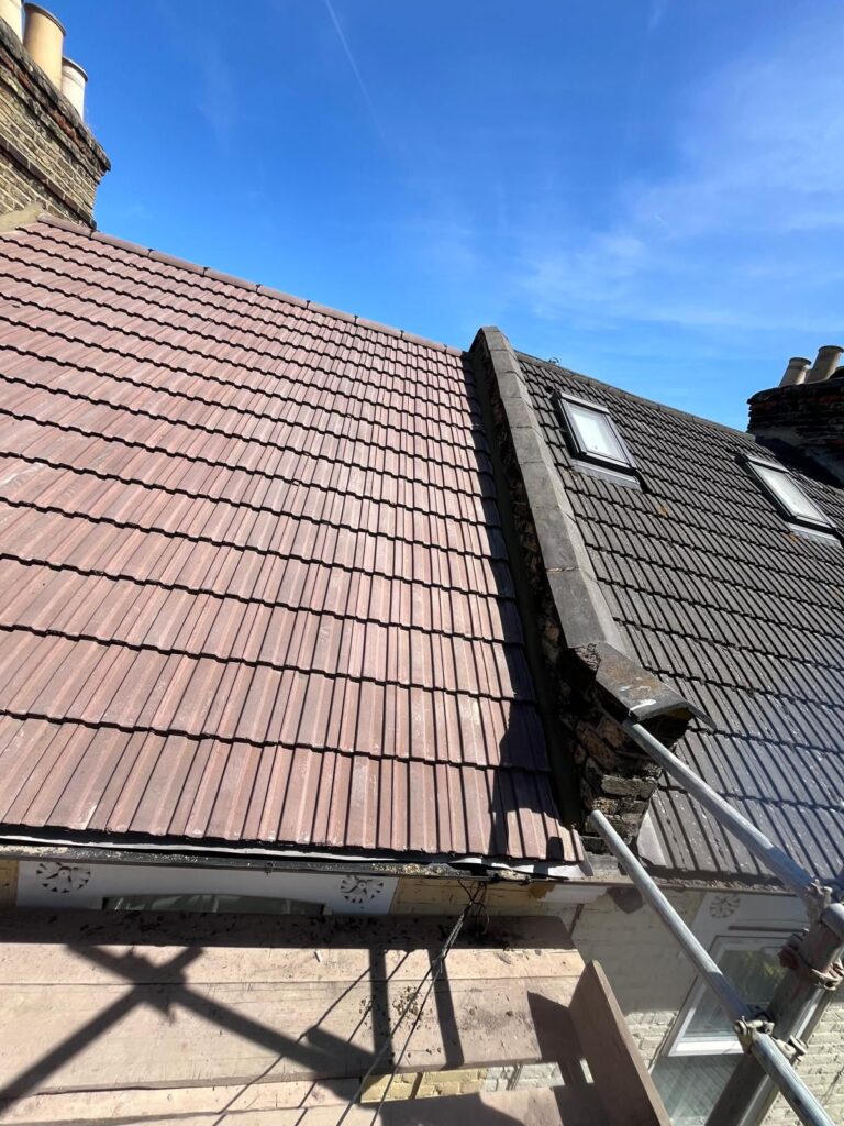 Velux / Roof Windows 5 Roof renovation in progress, showing new and existing roof tiles with velux windows, by checka roof ltd.