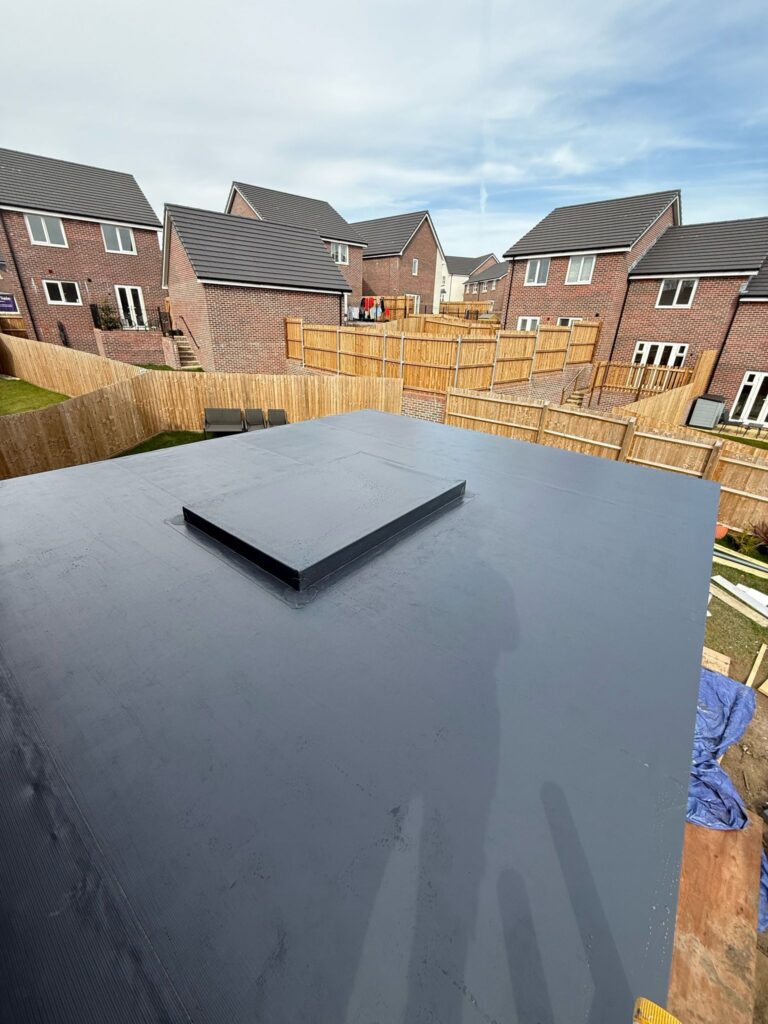 Roofline Upgrades 4 Newly installed flat roof with a skylight, demonstrating checka roof ltd's flat roofing services in london, kent, and essex.