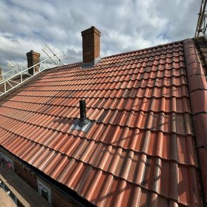 Chimney And Leadwork 9 Newly installed tiled roof with chimneys and ventilation pipe, showcasing checka roof ltd's expertise in london, essex & kent.