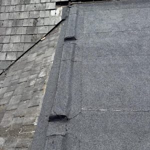 Roof Repair 10 Flat roof installation adjoining a tiled pitched roof, showcasing seamless integration by checka roof ltd in kent, essex, or london.